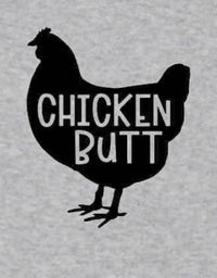 Folded white baby bodysuit displaying 'Guess What!? Chicken Butt' text and chicken graphic.