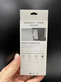 Laptop cell phone mount attached to notebook screen, showing easy magnetic suction feature.