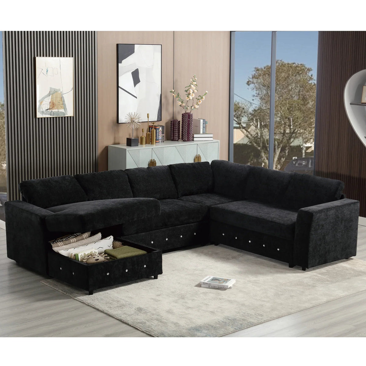 Large black U-shaped sectional sofa with chaise lounge, seating for six, and built-in storage compartment.