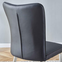 Modern dining chair angled to show black PU leather curved backrest and metal frame
