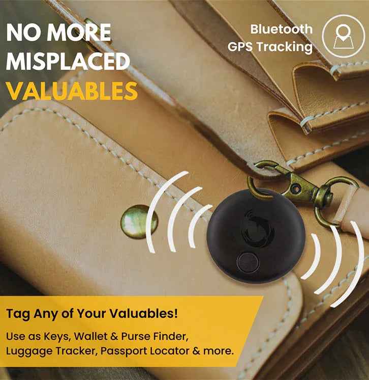 Hand holding Dolphin Pro Bluetooth tracker device attached to keys