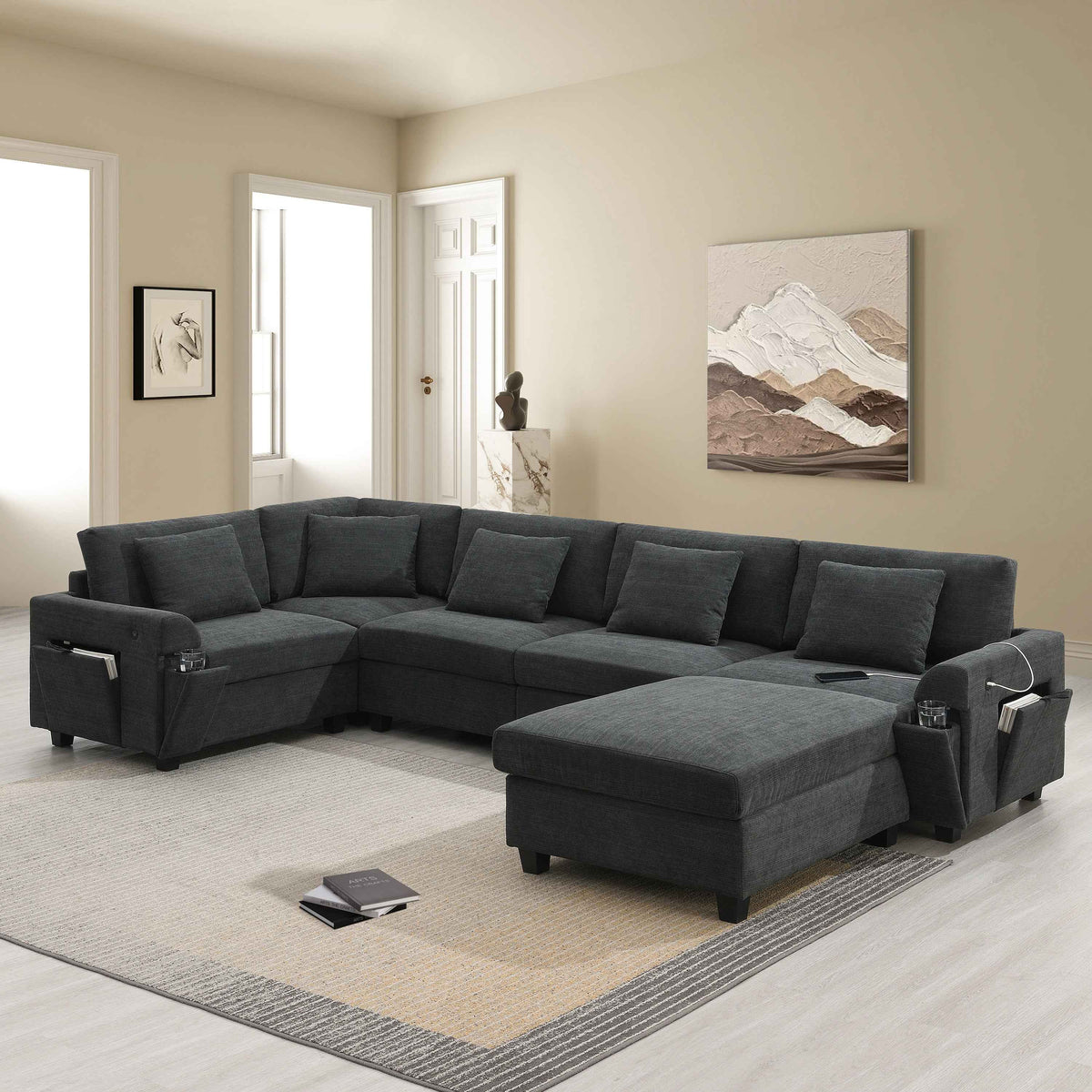 Large black U-shaped sectional sofa upholstered in chenille fabric, featuring seating for six people.