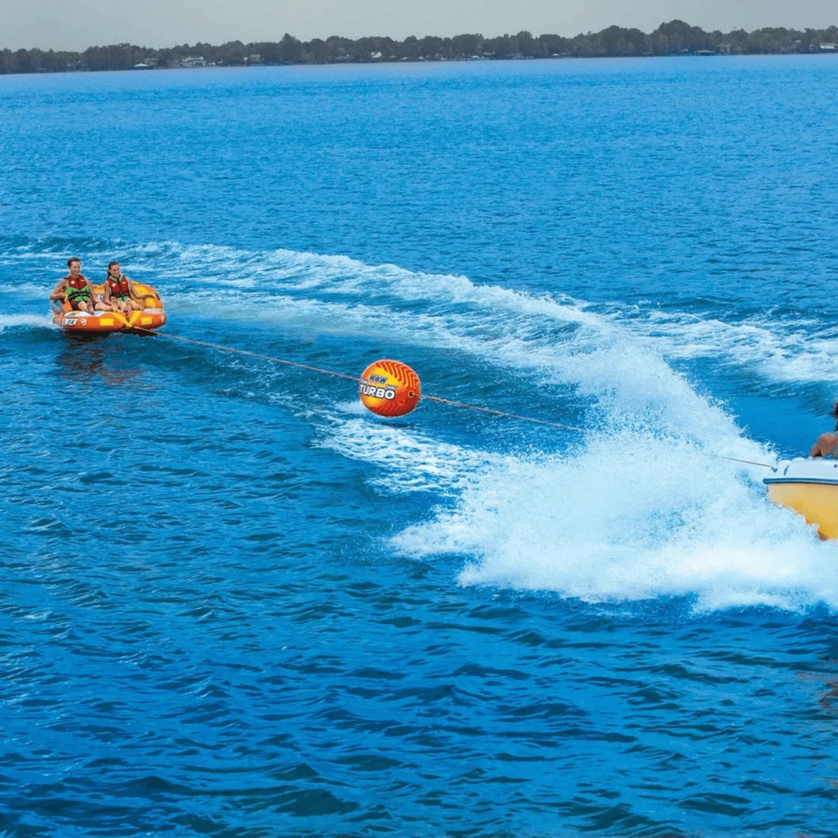 Visual showing enhanced takeoff and reduced rope spray with WOW Watersports Tow Turbo tow bobber in water.