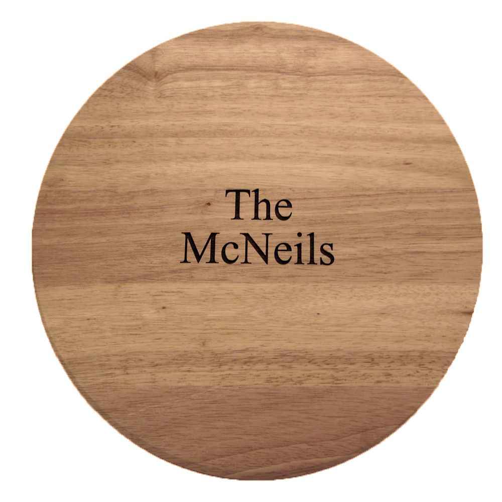 A wooden pizza board with slicing guides, a stainless steel rotary cutter, and a matching pizza server.