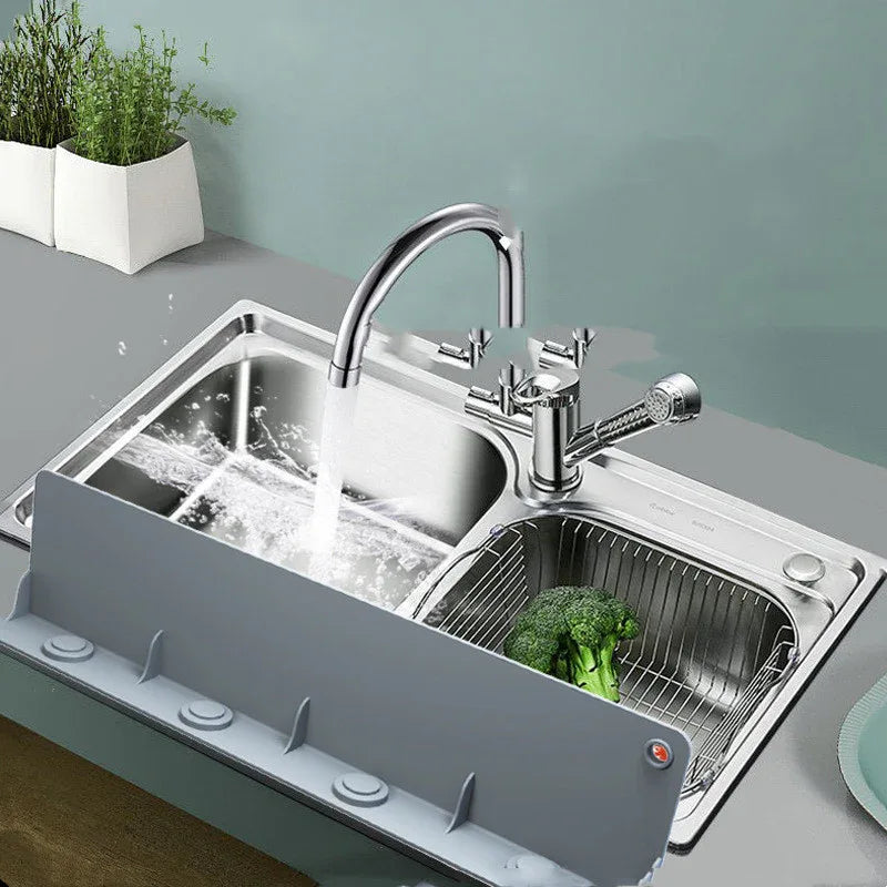 Silicone water baffle placed flat on kitchen countertop next to fresh vegetables.