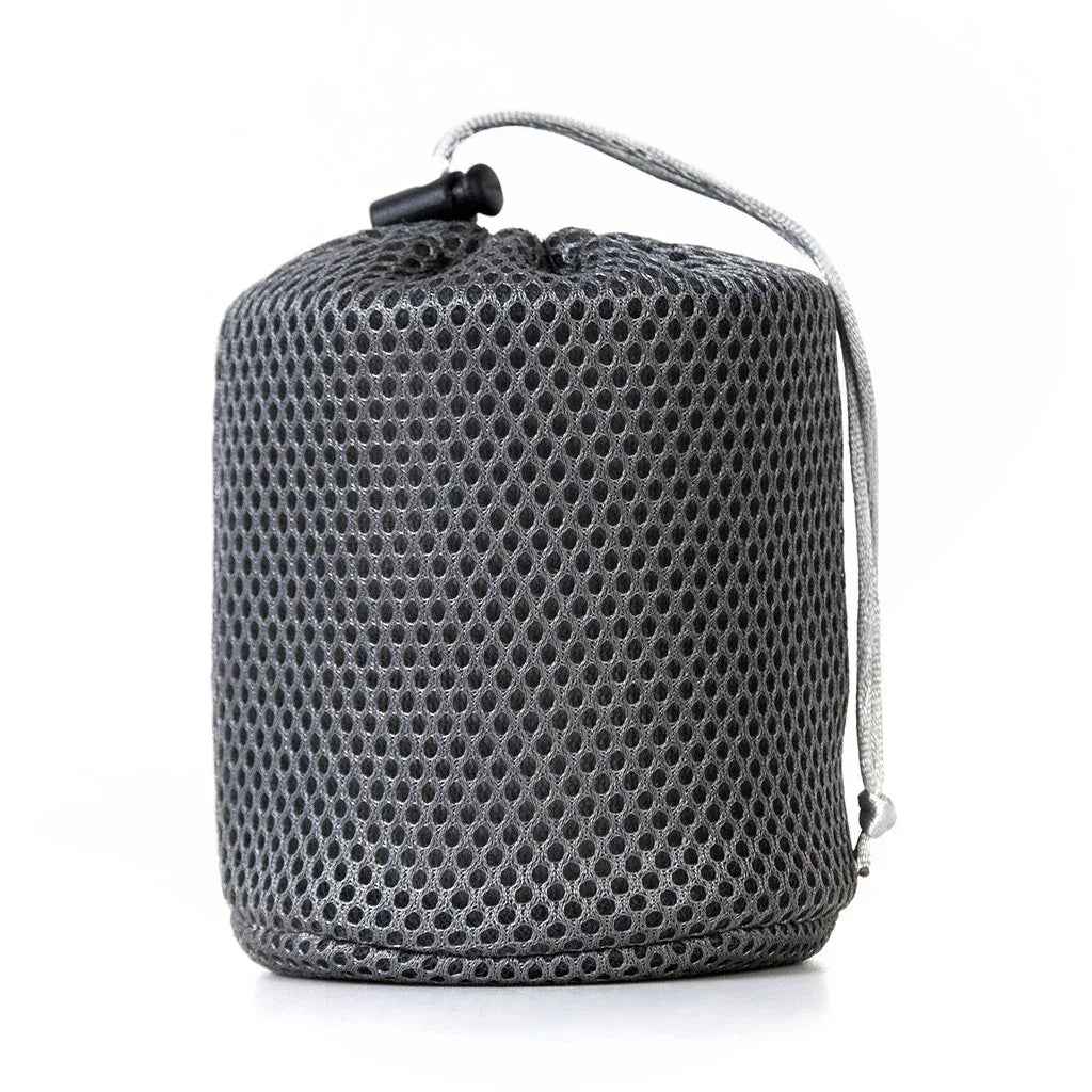 A lightweight 450ml titanium camping cup with folding handles, shown upright on a clean, white background.