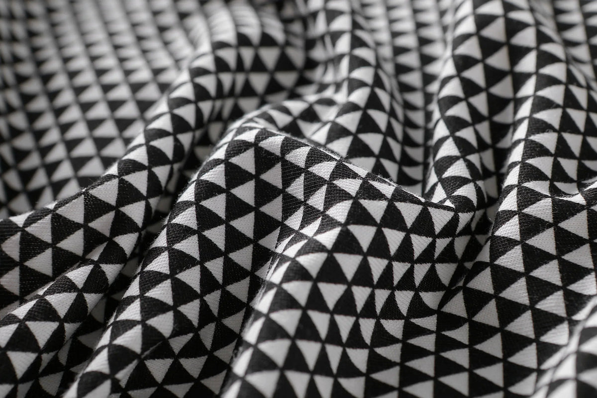 Baby sleeping peacefully inside the breathable, lightweight Greenwich baby sleep bag.