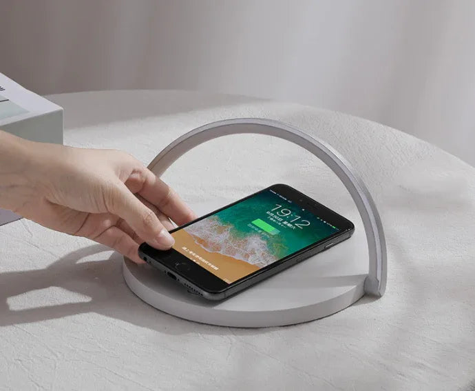 Diagram showing wireless charger block holder installation and phone placement process.