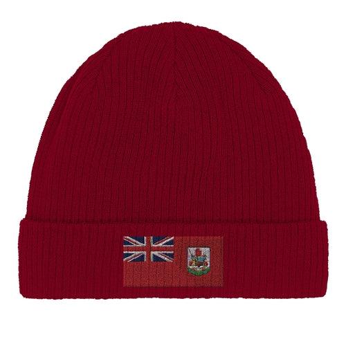 Close-up detail of the Bermuda flag emblem stitched onto green beanie