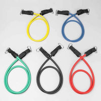 A set of colorful resistance bands with handles, door anchor, and ankle straps arranged on a white surface.