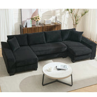 Large black U-shaped corduroy sleeper sofa with square arms, pull-out bed, and plush seating for four.