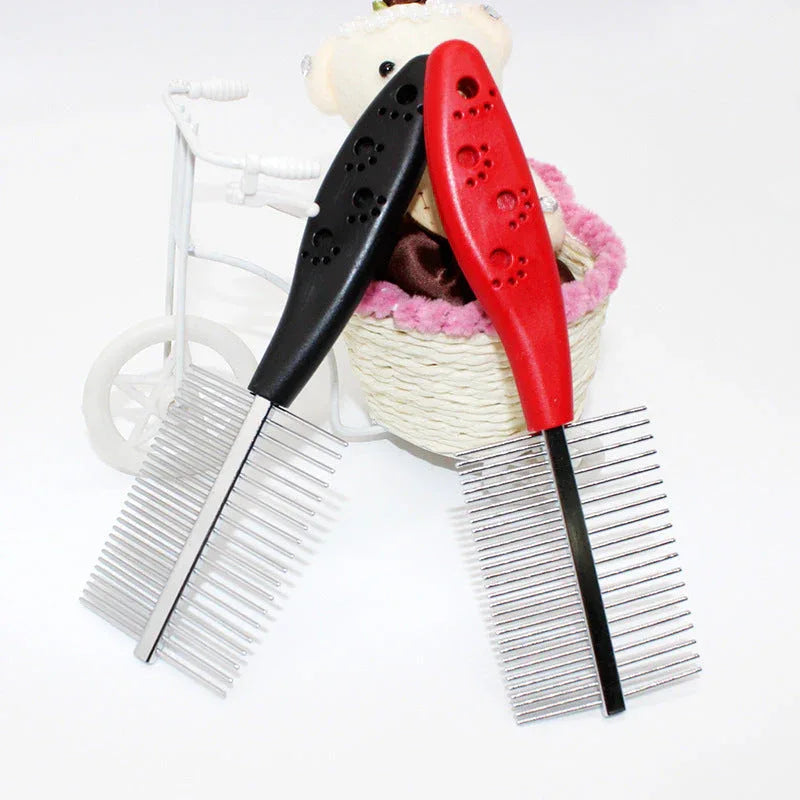 Blue pet grooming comb resting on white surface showcasing plastic handle and stainless steel teeth