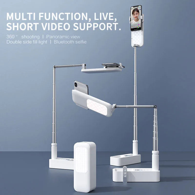 Folded portable selfie mobile phone holder with integrated ring light on white background.