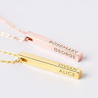 Close-up of personalized 4 side bar necklace with engraved names on each side.
