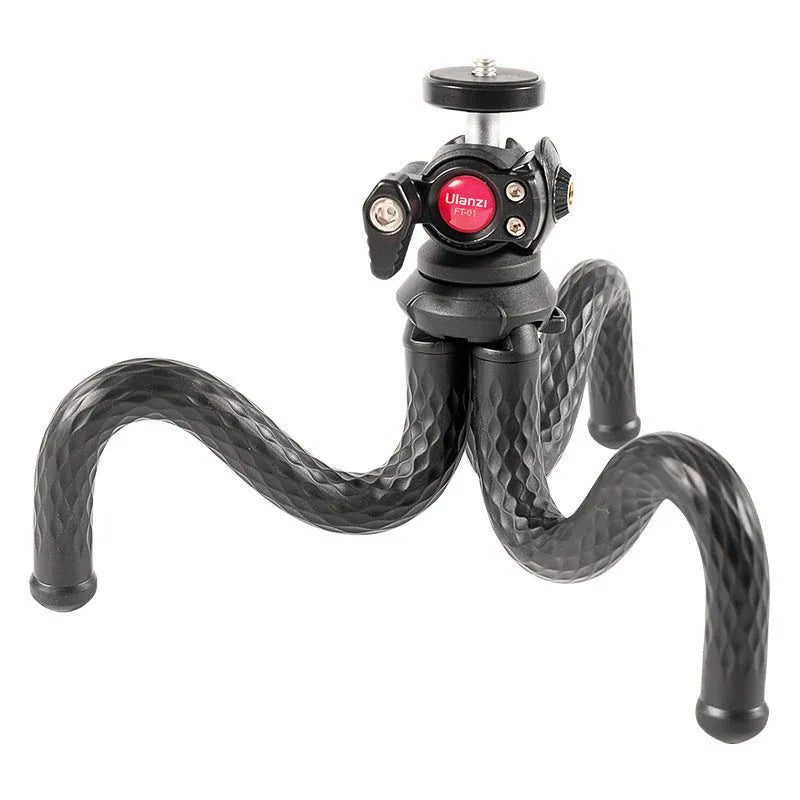 Tripod fully extended with flexible legs holding a smartphone firmly in place.