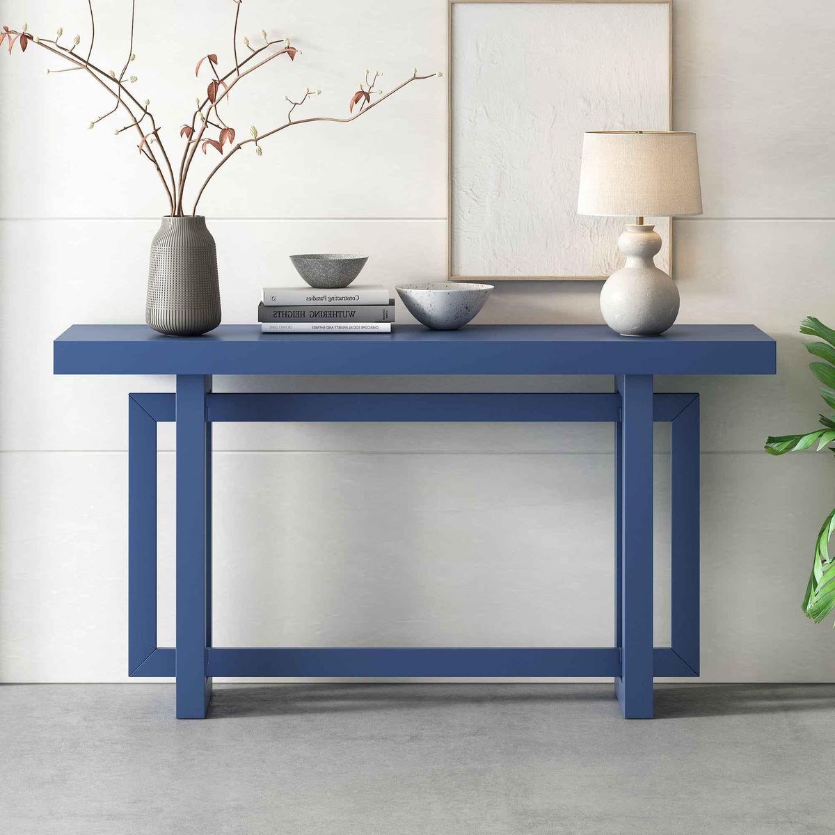 Close-up of wood grain on the table top of a long, navy blue console table.