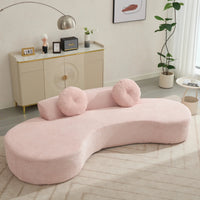 Large pink curved sofa with soft upholstered seats and a modern, minimalist design, comfortably seating three people.