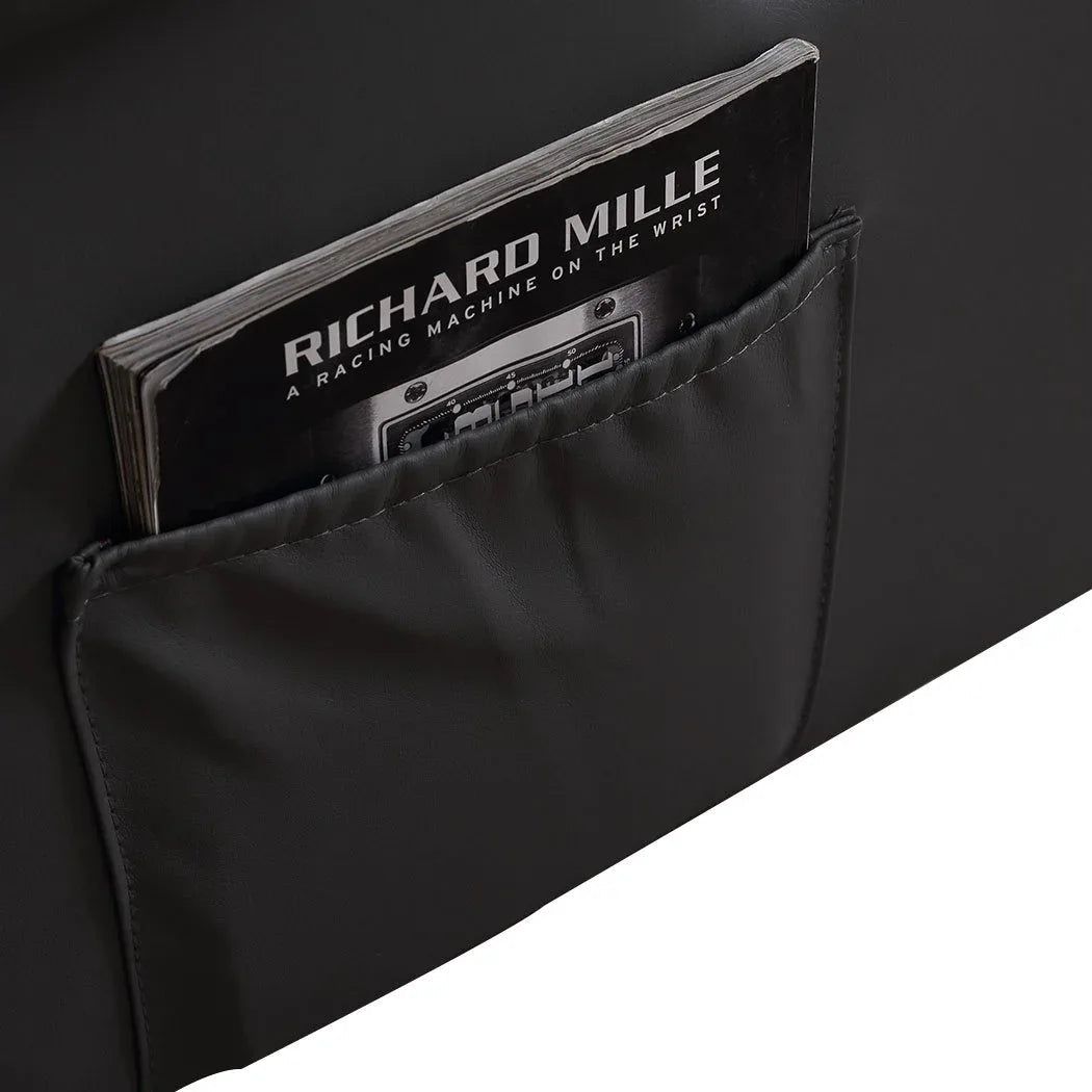 Detailed stitching and plush cushioning on the armchair's armrest and footrest