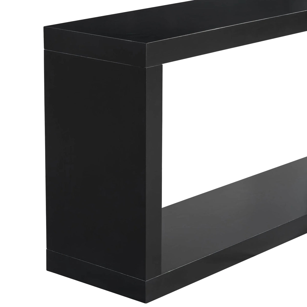 Black square entrance table under a round mirror in a minimalist styled entryway