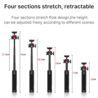 Tripod in compact form with folded legs resting on a flat surface.
