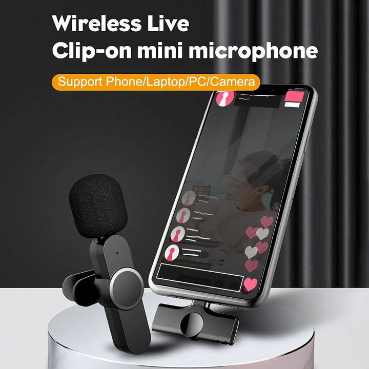 Wireless lavalier microphone with lapel clip and compact carrying case on a white background.