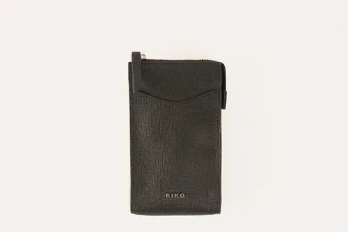 Overhead view of pink leather crossbody phone wallet with zipper partially open.