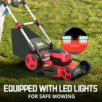 Red cordless lawn mower with brushless motor parked on trimmed lawn