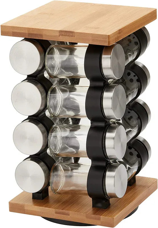 Close-up of refillable glass spice jars with bamboo lids and silicone funnel on spice rack.