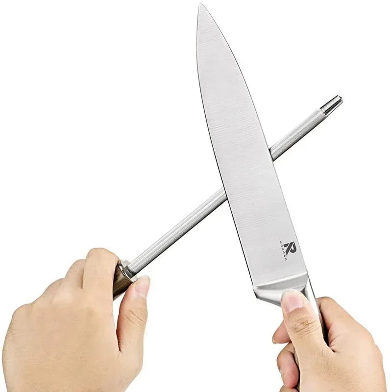 Wooden rotating knife block holding multiple stainless steel knives with wood color handles.