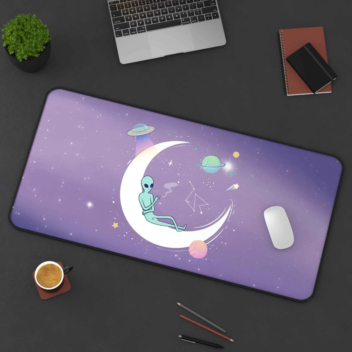 Desk mat featuring a chill alien in space theme with vibrant cosmic colors