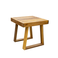 Acacia wood chair and ottoman showcasing weather-resistant blue cushions