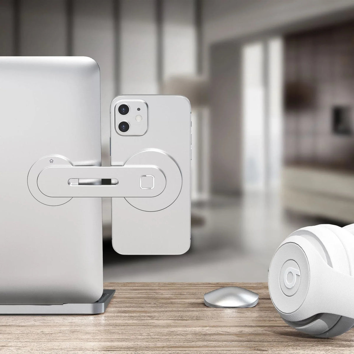 Phone held securely on laptop screen by the magnetic collapsible mount showing multifunction use.