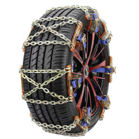 Car tire fitted with anti-skid chain on snowy road showcasing emergency use.