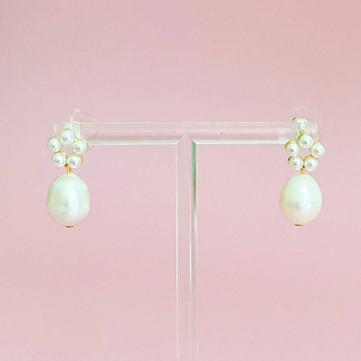 Side angle view of a Blooming Freshwater Pearl Drop Earring showcasing its elegant pearl drop and circular bead arrangement.