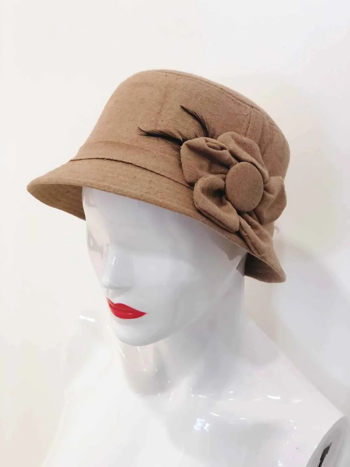 Beige bucket hat featuring embroidered flower designs, displayed on a plain background.