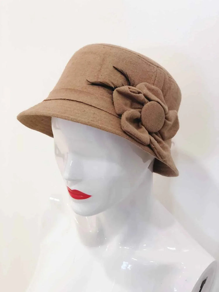 Beige bucket hat featuring embroidered flower designs, displayed on a plain background.