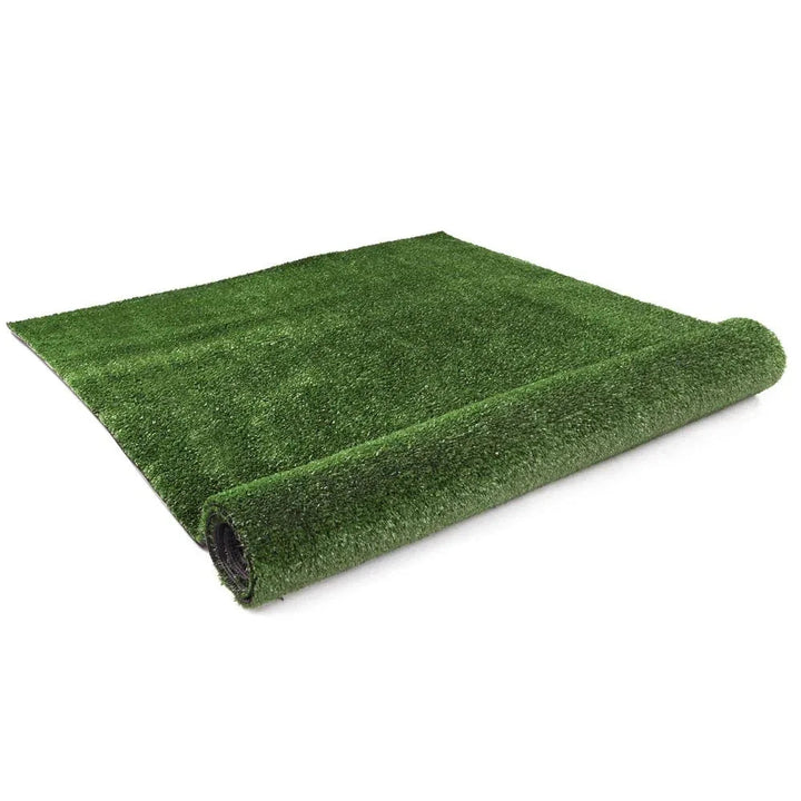 Close-up of realistic, lush green synthetic grass turf outdoors in natural light.