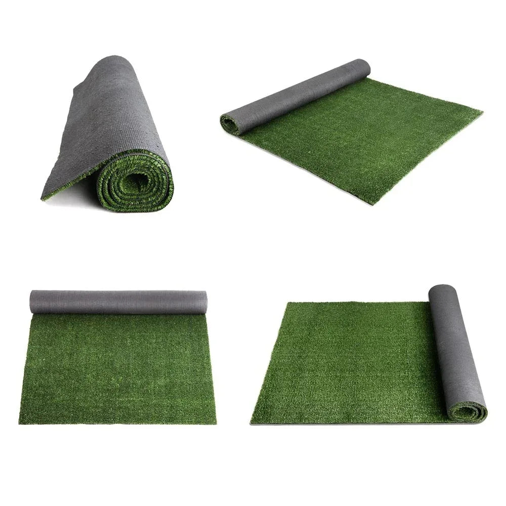 Artificial grass lawn installed in a backyard, creating a neat and even green surface.