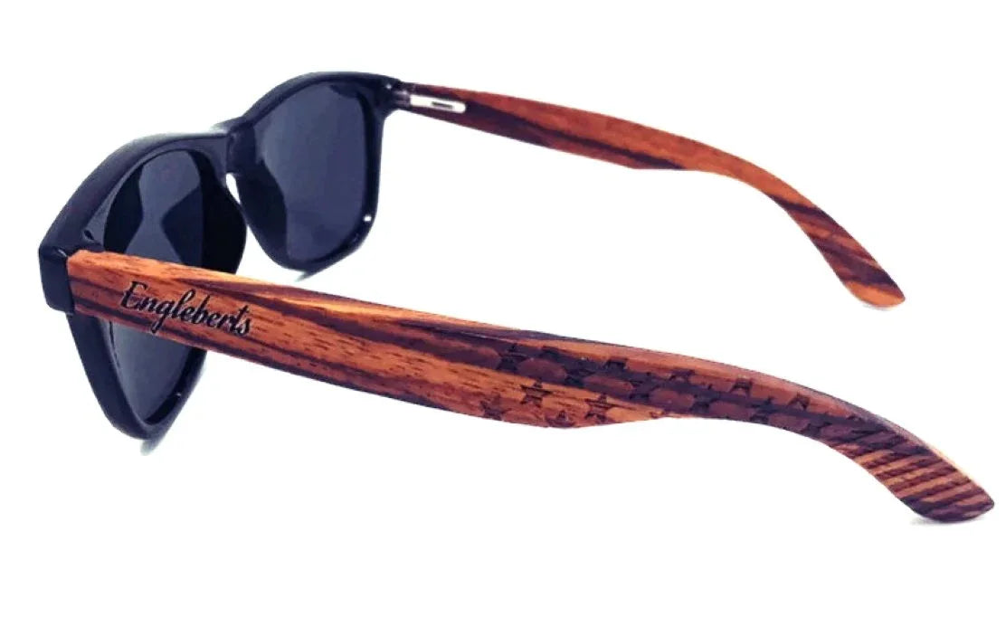 Side view of Zebrawood sunglasses showing wooden frame and polarized dark lenses.