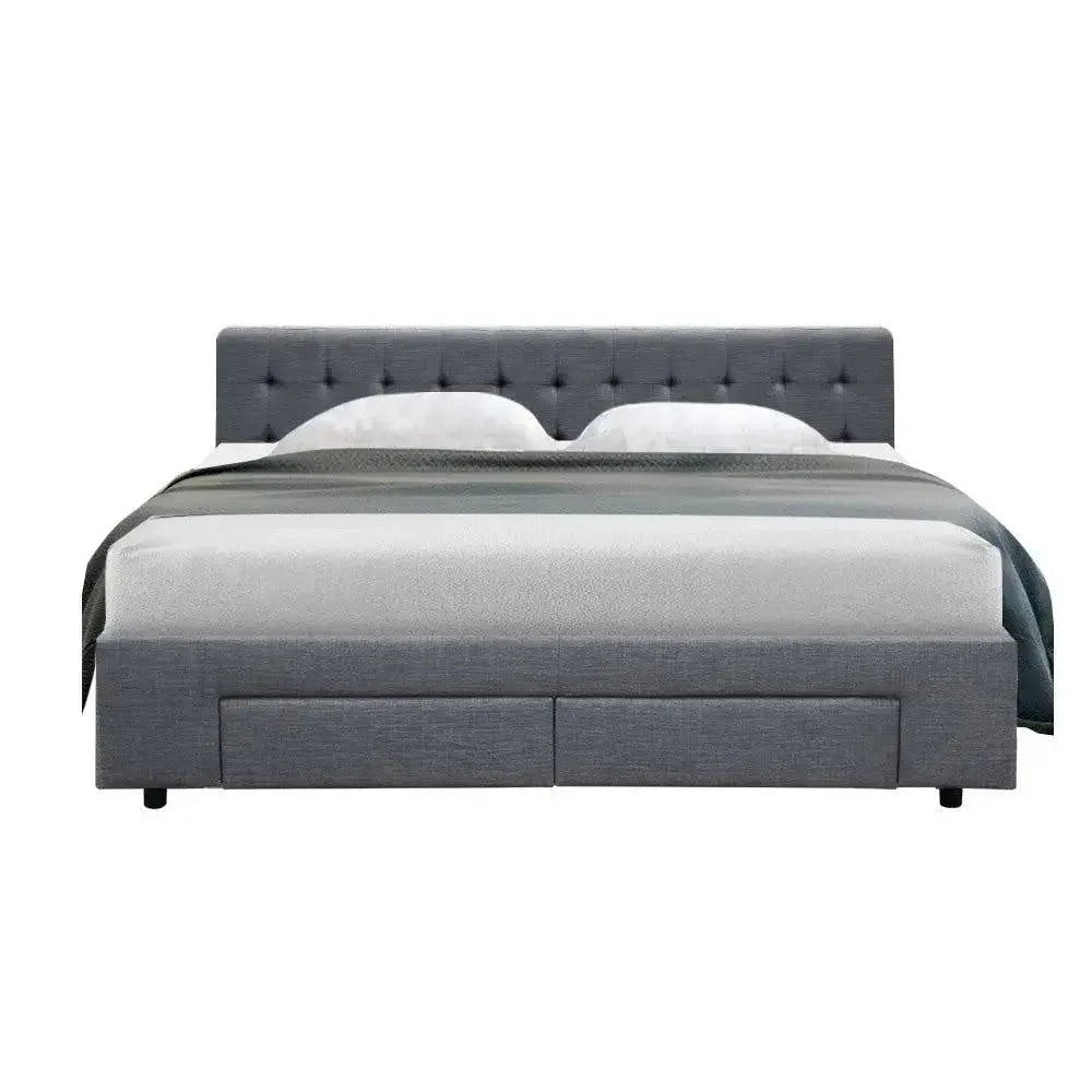 Close-up of tufted headboard with soft high-density foam padding in grey fabric upholstery.