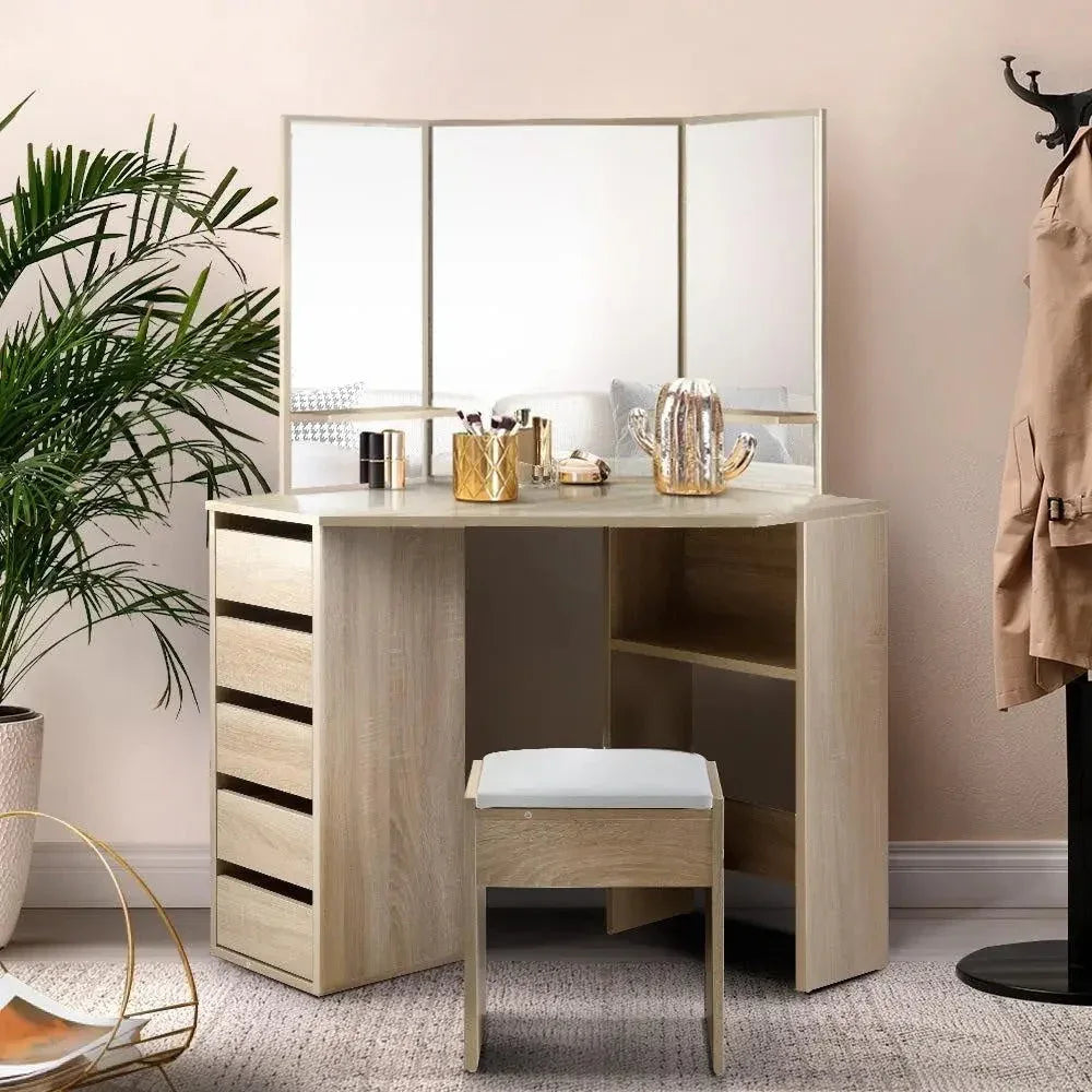 Top view of oak vanity desk tabletop, mirror panels, and padded makeup stool