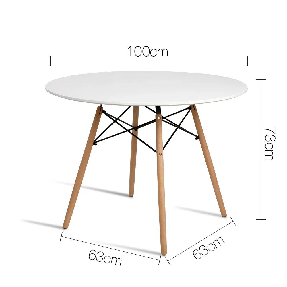Close-up of white round tabletop showing smooth matt finish and wooden legs