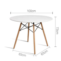 Close-up of white round tabletop showing smooth matt finish and wooden legs