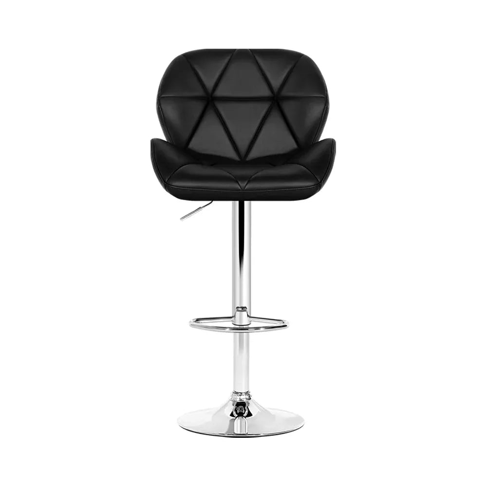 Bar stool seat cushion detail showing smooth black faux leather upholstery and curved backrest