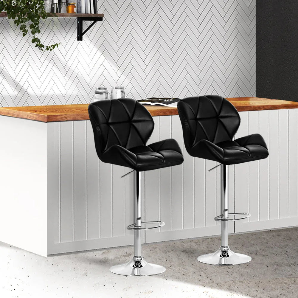 Close up of height adjustment mechanism and chrome base of kitchen bar stool