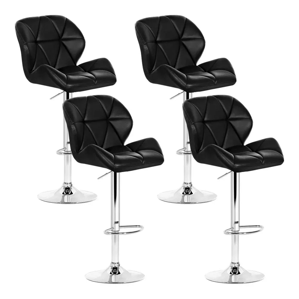 Set of four modern black and chrome kitchen bar stools with faux leather seats and chrome bases.