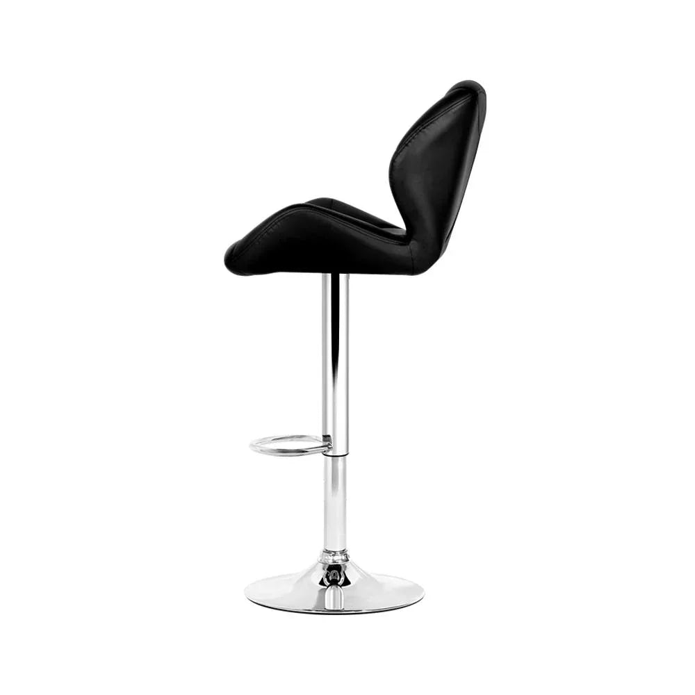 Top-down view showing stitching detail on black faux leather kitchen bar stool seat.