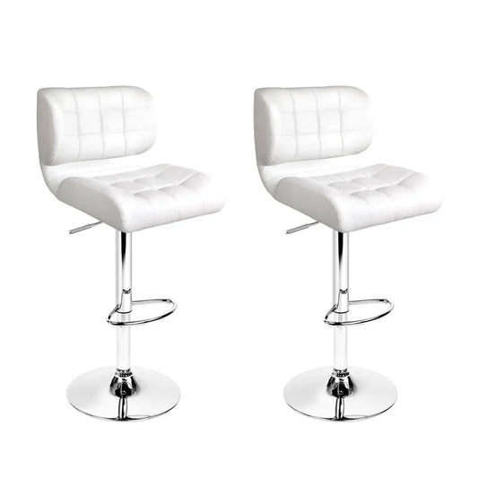 Two white PU leather bar stools with chrome bases and gas lift levers, shown in a bright setting.