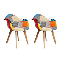 Two fabric dining chairs with beige fabric seats and natural wooden legs on white background.