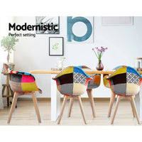 Pair of beige fabric dining chairs positioned side by side on white background.